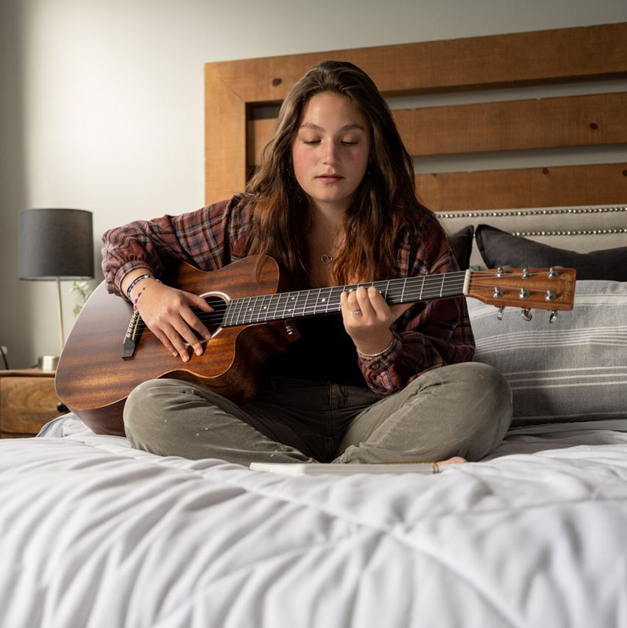 Lifestyle photo of a beginner guitarist